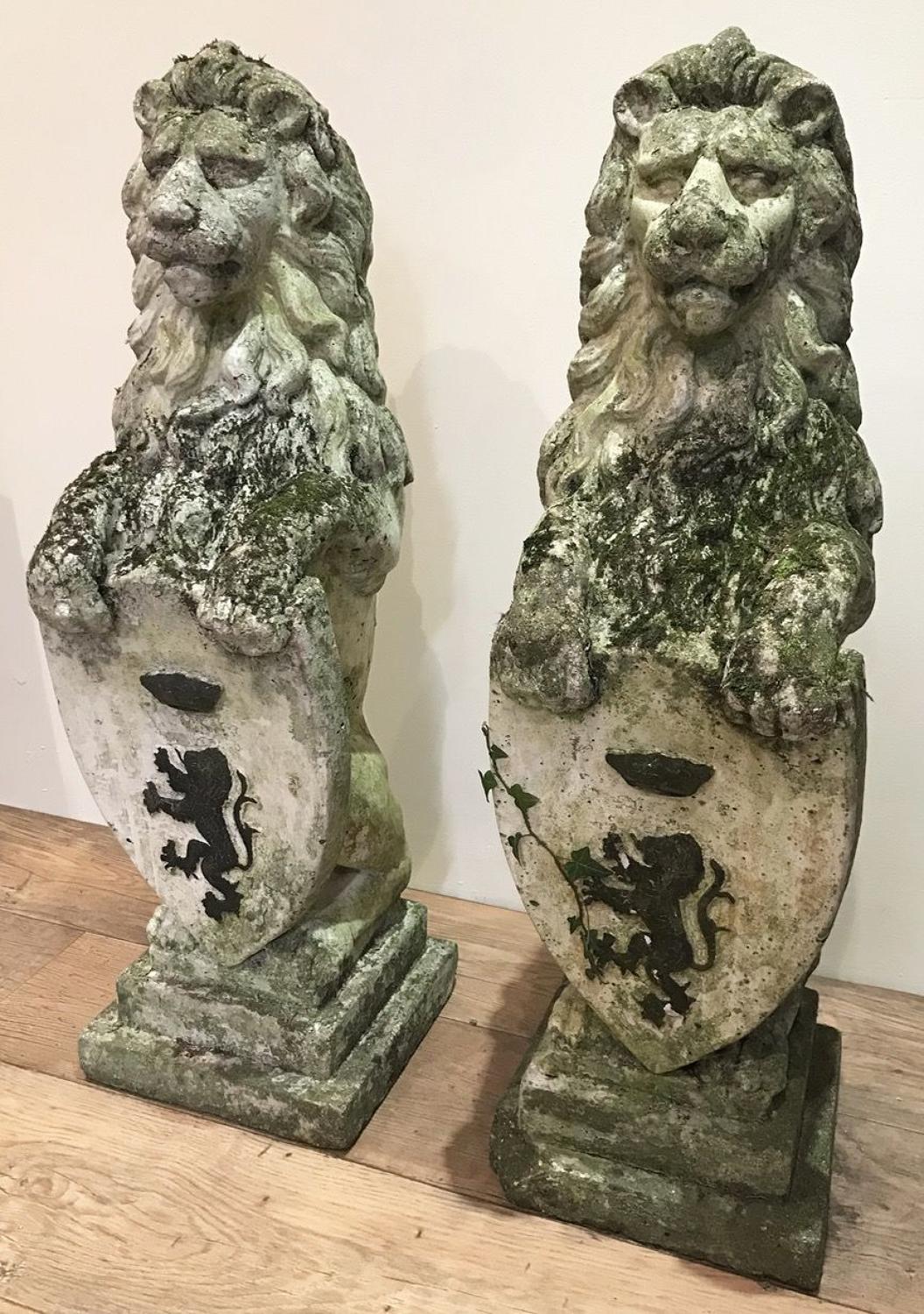 PAIR OF COMPOSITION LIONS