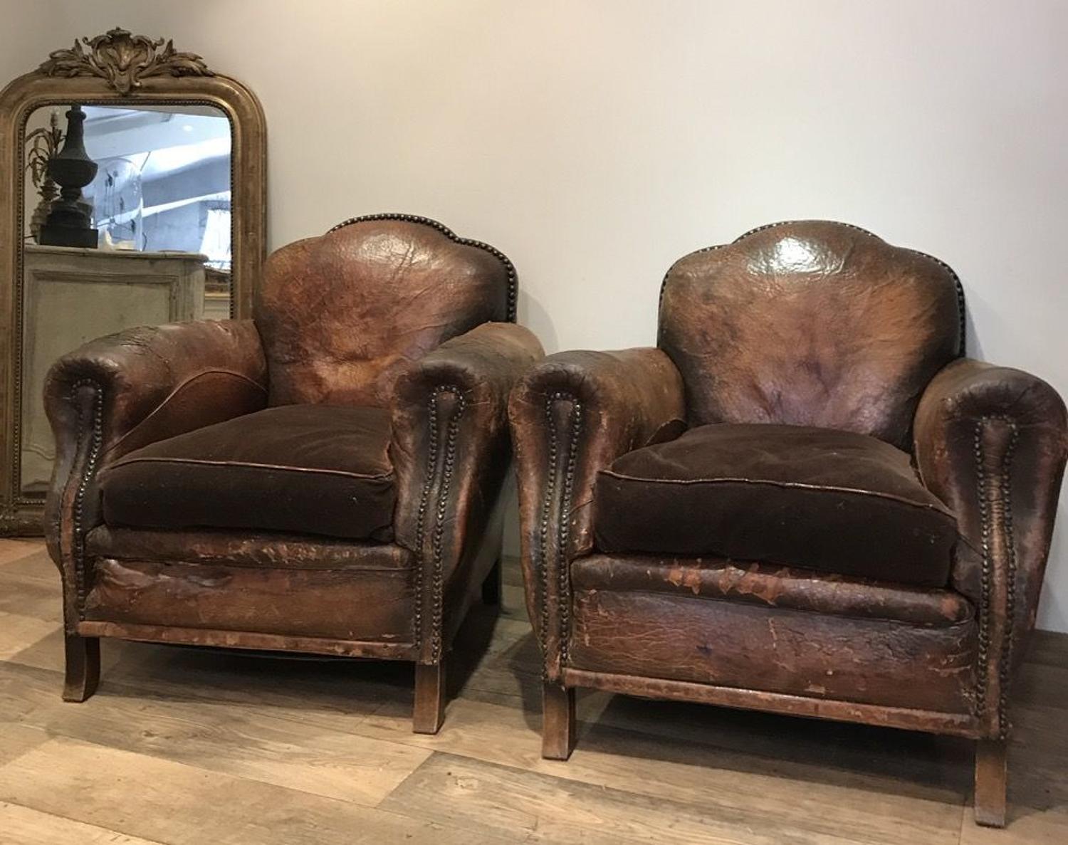 PAIR OF STUDDED LEATHER ARMCHAIRS