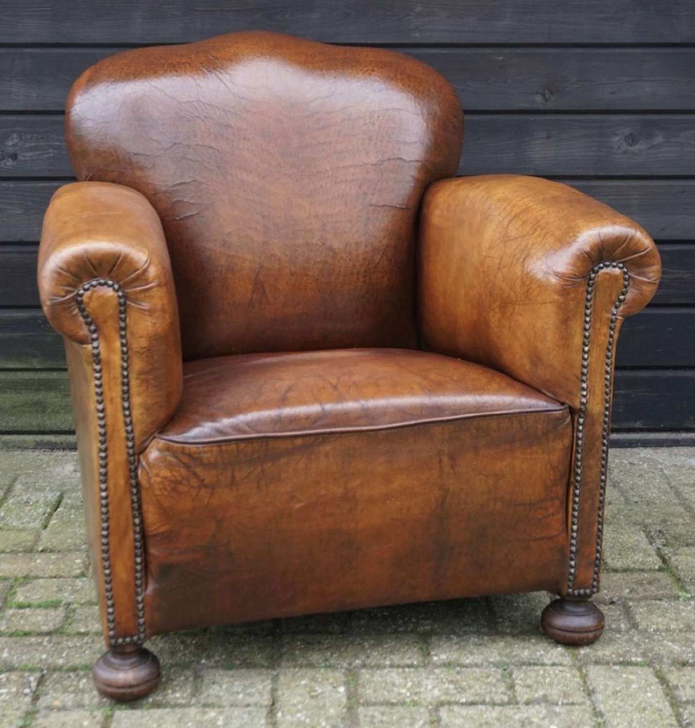 ANTIQUE BROWN LEATHER ARMCHAIR