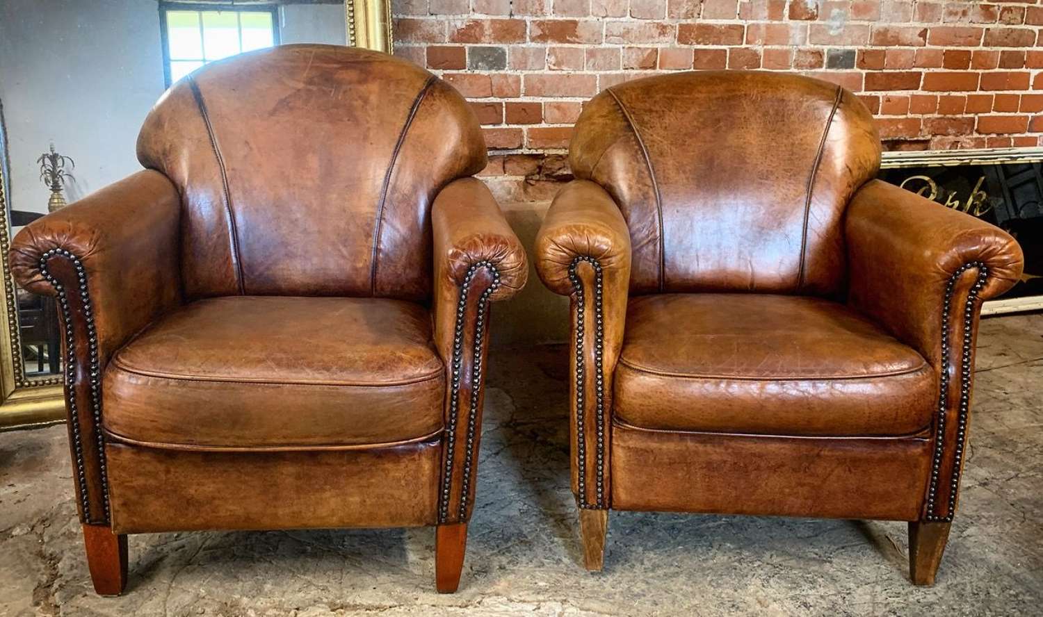 PAIR OF VINTAGE SHEEPSKIN LEATHER ARMCHAIRS
