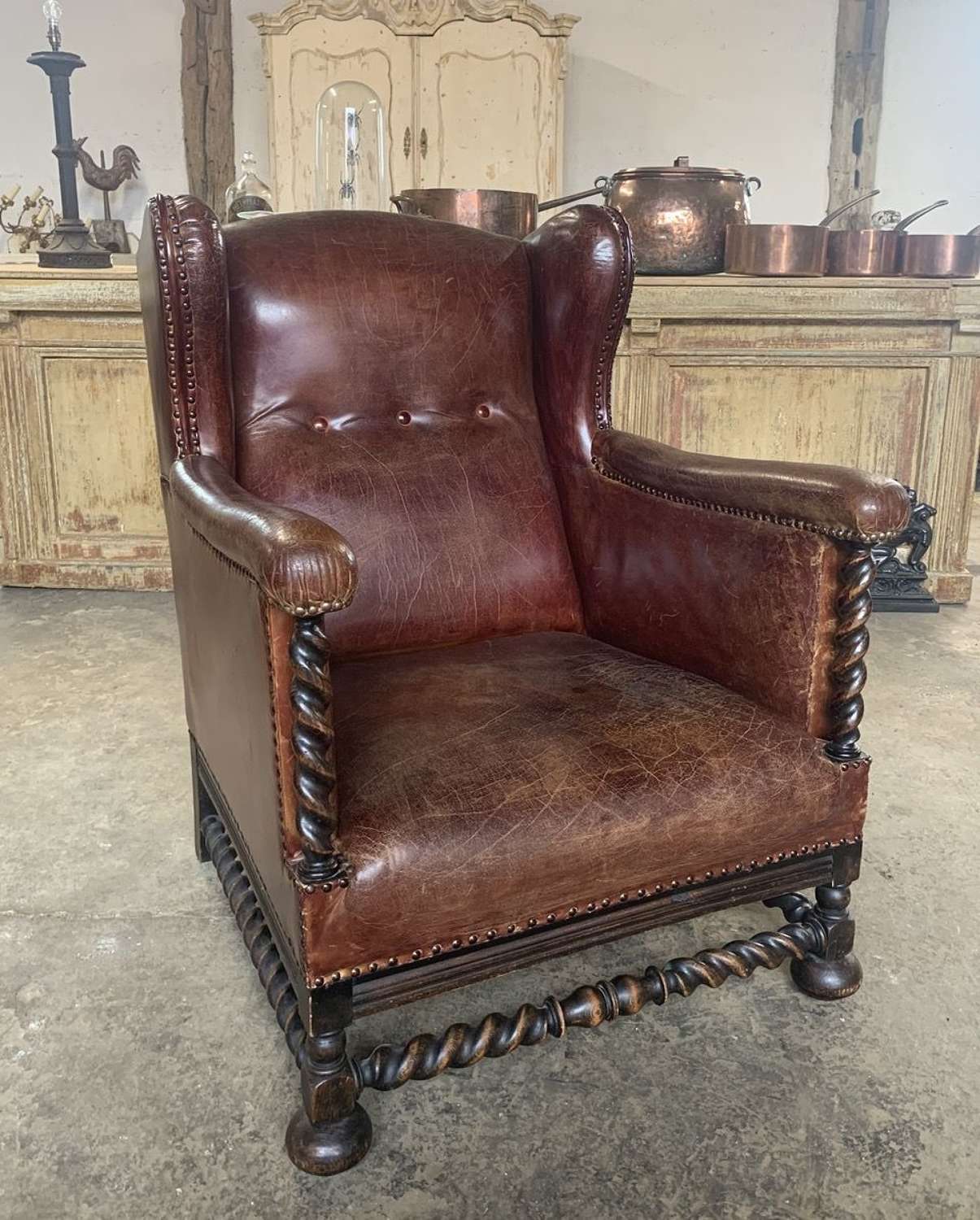 ANTIQUE LEATHER WINGBACK ARMCHAIR