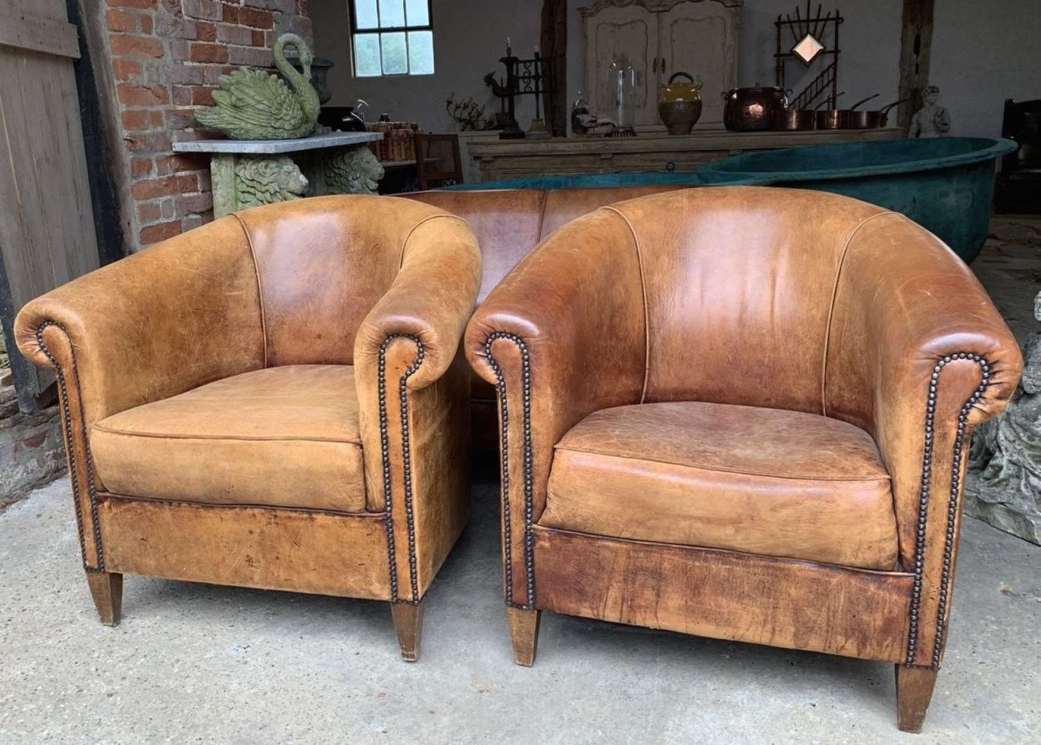 PAIR OF VINTAGE LEATHER TUB CHAIRS