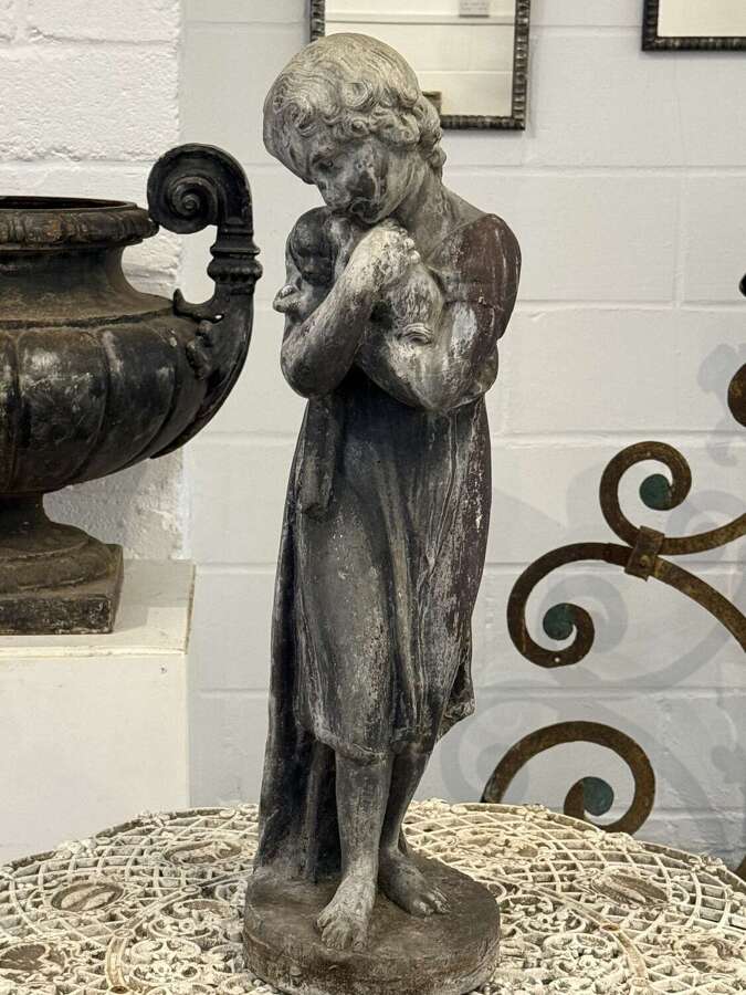 Antique Lead Statue Of A Girl Holding A Dog